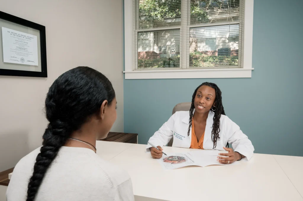 Doctor Angela Lipscomb-Hudson reviewing a personalized plan with a patient